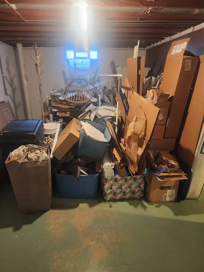 Roll-off dumpster container at job site for 8 Yard Dumpster Rental in Muscle Shoals